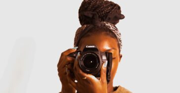 A black lady with a camera